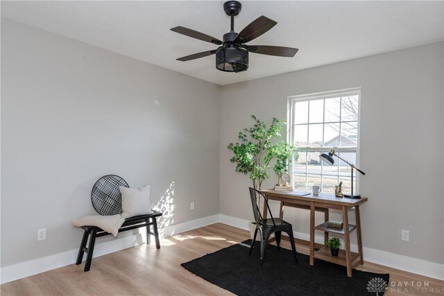 office with ceiling fan, baseboards, and wood finished floors