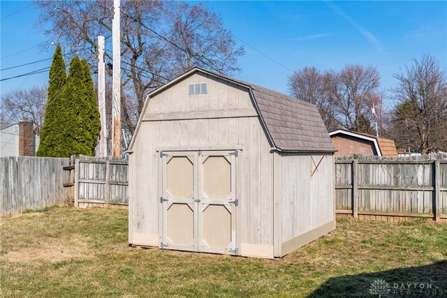 view of shed featuring a fenced backyard