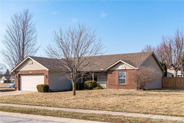 ranch-style home featuring brick siding, fence, a front yard, covered porch, and an attached garage