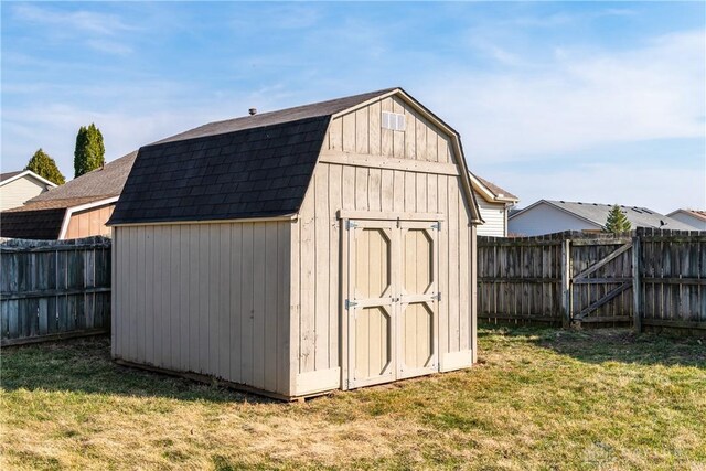 view of shed featuring a fenced backyard