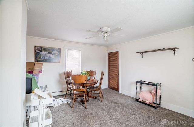 carpeted dining area with crown molding, baseboards, a baseboard heating unit, and a ceiling fan