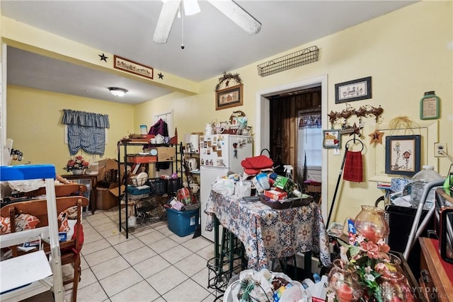 interior space featuring light tile patterned flooring and a ceiling fan