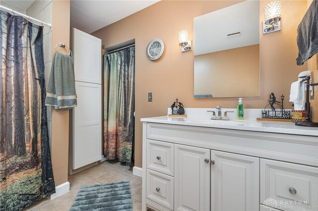 bathroom with vanity, tile patterned floors, and a shower with shower curtain