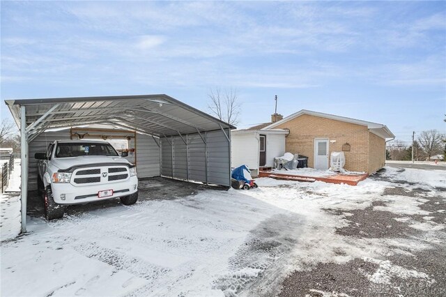 exterior space with a carport