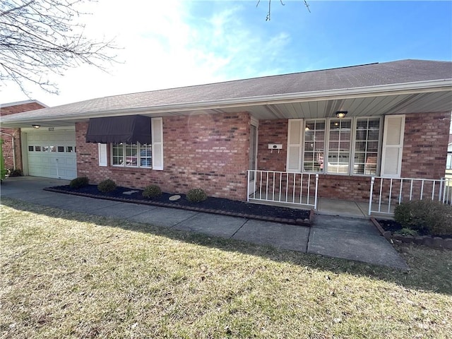 doorway to property with brick siding, covered porch, and an attached garage