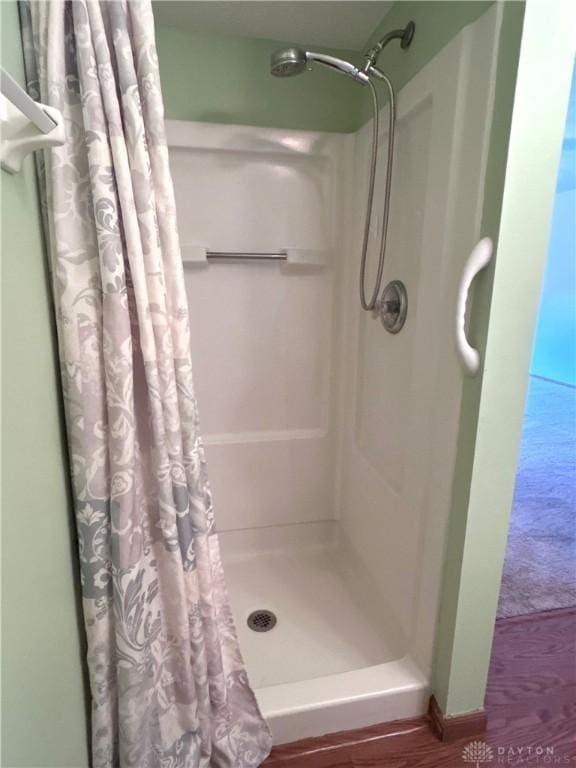 full bathroom with a shower with shower curtain