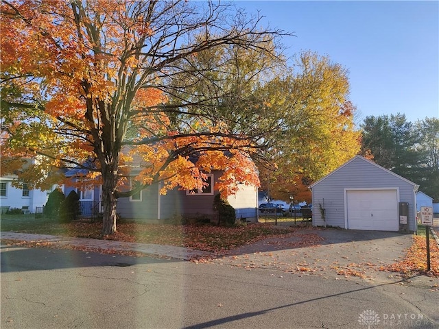 exterior space with a garage and an outdoor structure