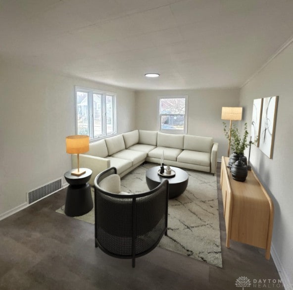 living area featuring visible vents and baseboards