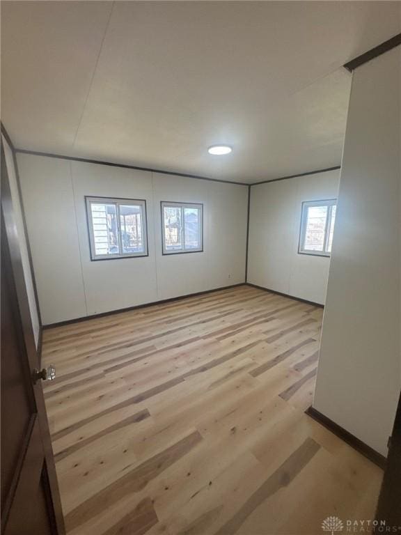 unfurnished room featuring light wood-type flooring