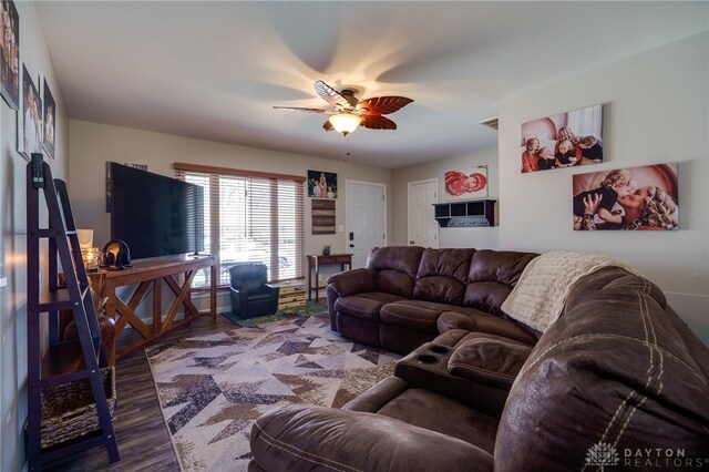 living area with ceiling fan and wood finished floors