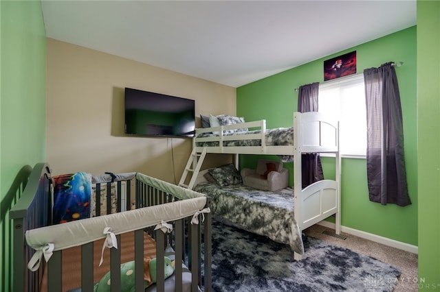 carpeted bedroom with baseboards