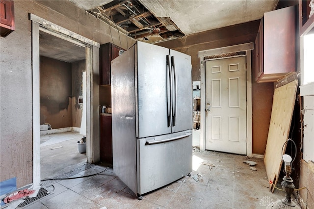 kitchen featuring freestanding refrigerator