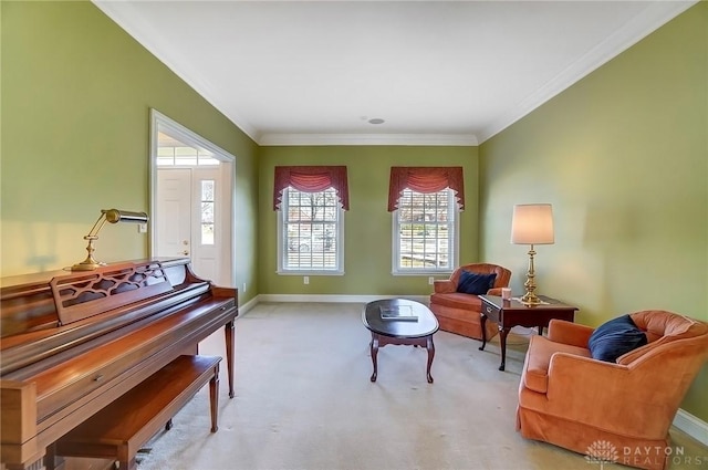 living area with carpet flooring, baseboards, and ornamental molding