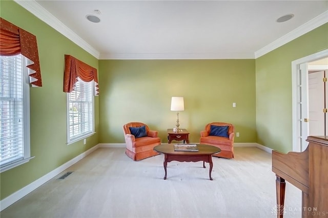 living area featuring visible vents, carpet floors, baseboards, and ornamental molding