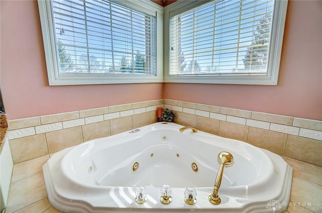 full bath with a jetted tub and a wealth of natural light