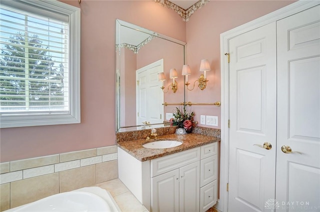 bathroom with vanity and a bathtub