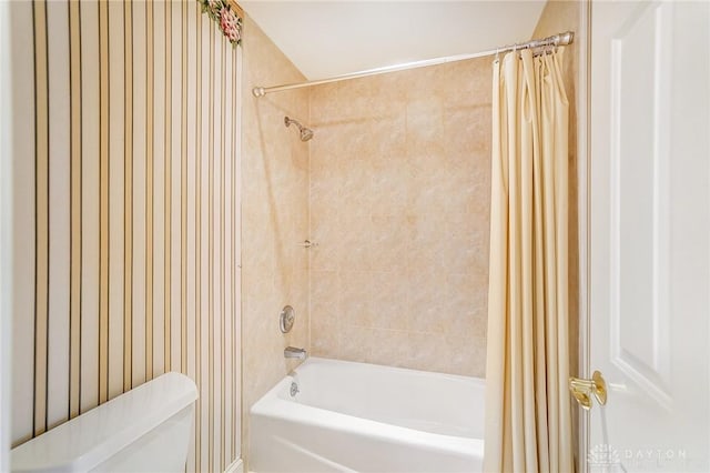 bathroom with shower / tub combo