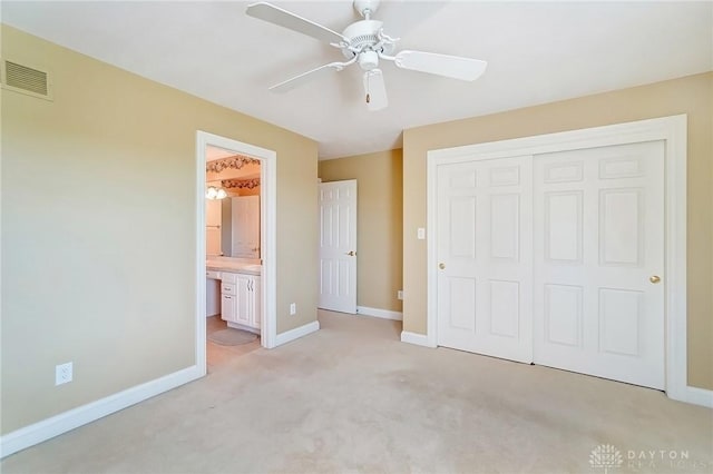 unfurnished bedroom featuring baseboards, visible vents, and a closet