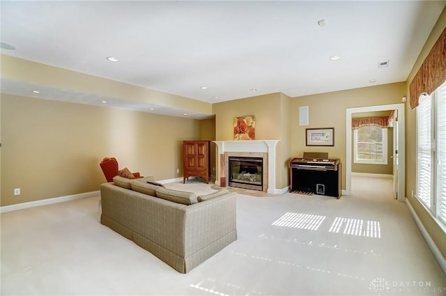 living area with visible vents, light carpet, recessed lighting, a fireplace, and baseboards