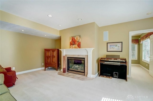 living area with visible vents, baseboards, carpet flooring, recessed lighting, and a tile fireplace