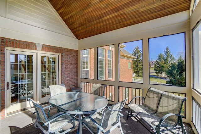 sunroom featuring wooden ceiling and vaulted ceiling