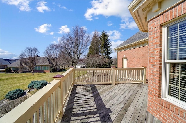 wooden terrace with a yard