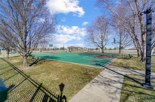 view of basketball court featuring community basketball court, a yard, and fence