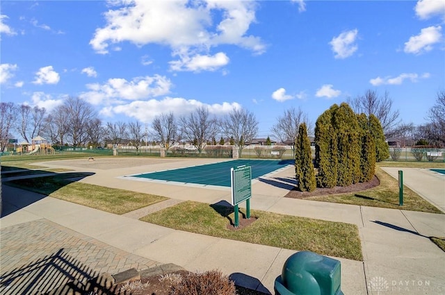 view of community with playground community and fence