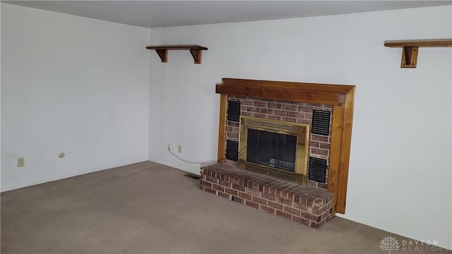 living room featuring carpet flooring, a brick fireplace, and visible vents