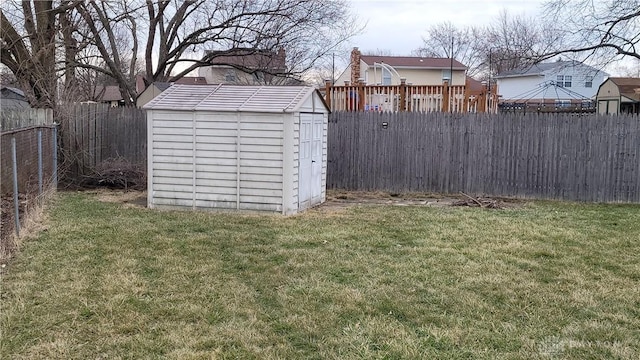 view of shed with a fenced backyard