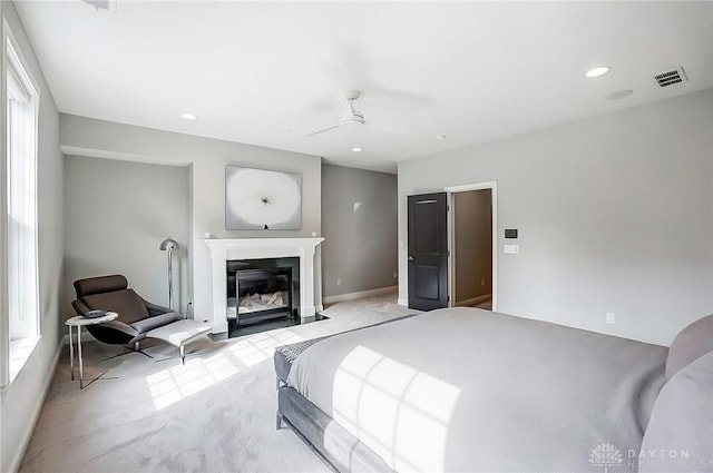 bedroom featuring a fireplace with flush hearth, recessed lighting, visible vents, and ceiling fan