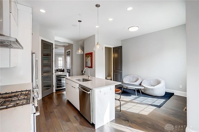 kitchen featuring beverage cooler, a sink, white cabinets, gas range oven, and dishwasher