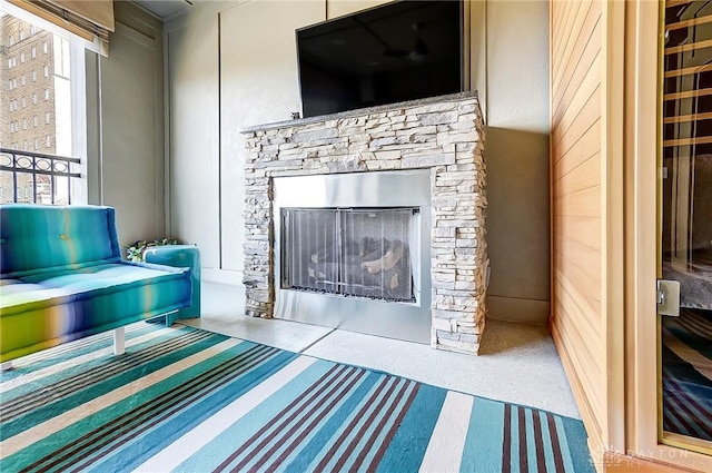 carpeted living room with a fireplace