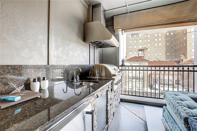 balcony with a sink and area for grilling