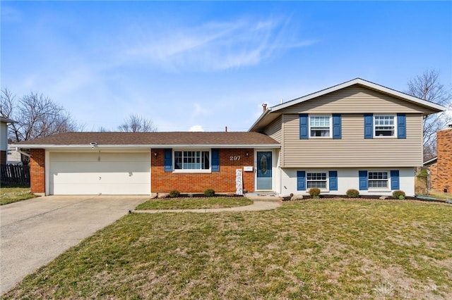 tri-level home with brick siding, fence, concrete driveway, a front yard, and a garage