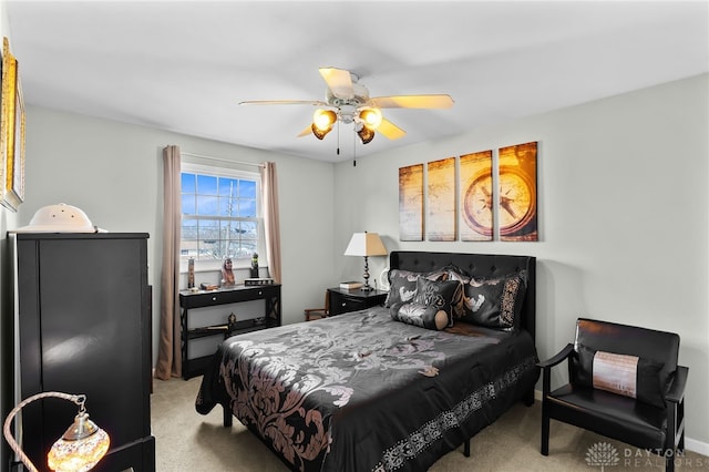 bedroom with carpet and a ceiling fan