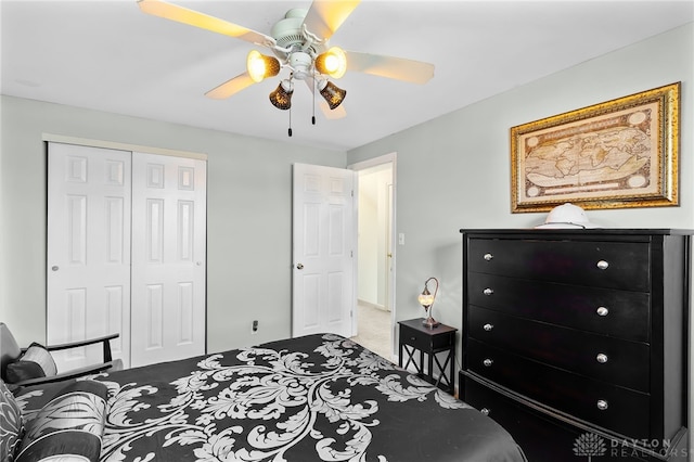 bedroom featuring a closet, carpet flooring, and a ceiling fan