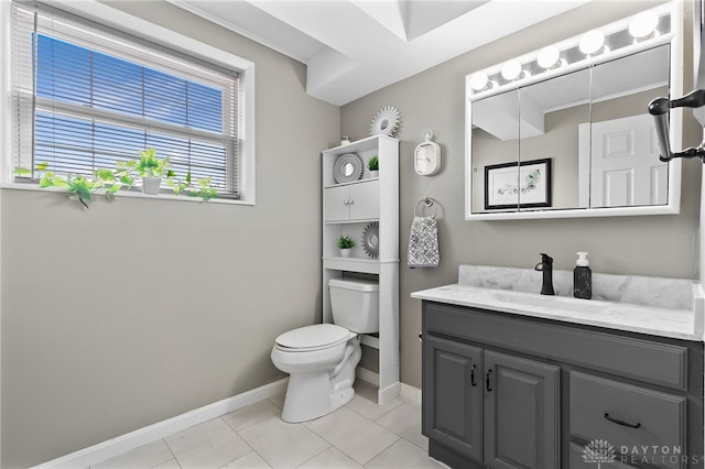 bathroom with tile patterned floors, toilet, vanity, and baseboards