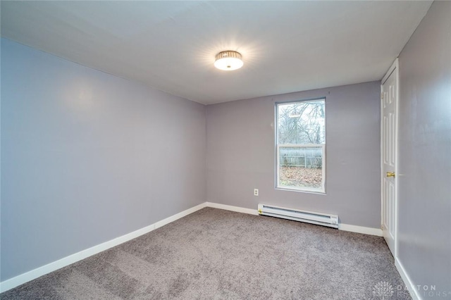 empty room featuring baseboard heating, baseboards, and carpet floors