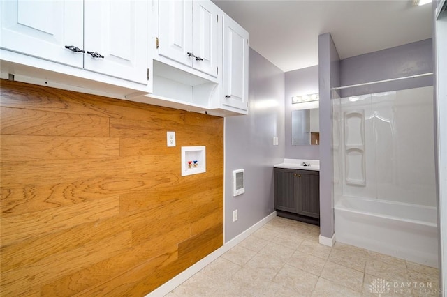 bathroom with tile patterned flooring, visible vents, baseboards, vanity, and washtub / shower combination