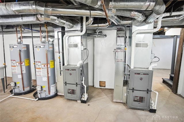 utility room featuring gas water heater and heating unit