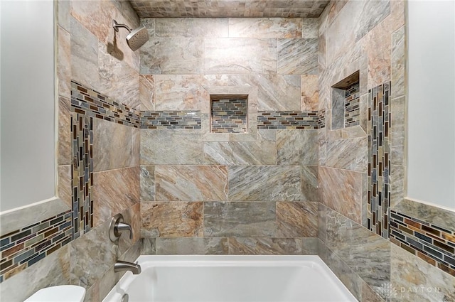 full bathroom featuring toilet, tile walls, and bathtub / shower combination