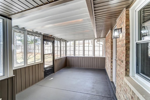 unfurnished sunroom with a healthy amount of sunlight