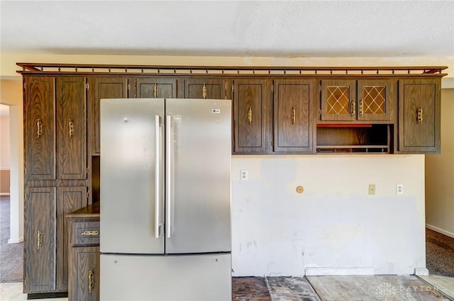 kitchen with carpet flooring and freestanding refrigerator