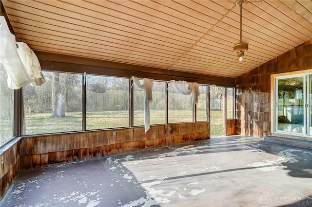 unfurnished sunroom featuring lofted ceiling