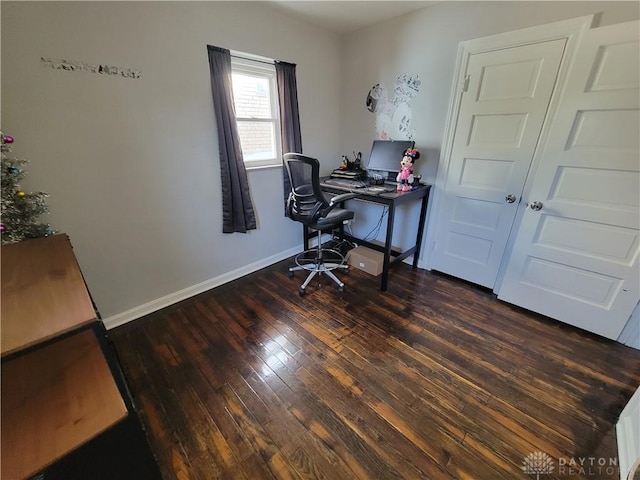 home office featuring baseboards and wood-type flooring