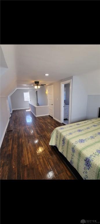 bedroom featuring baseboards and wood-type flooring