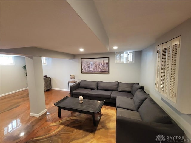 living area featuring recessed lighting and baseboards