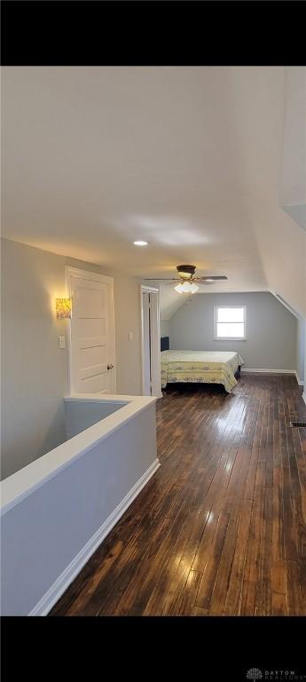 bonus room with ceiling fan, vaulted ceiling, and hardwood / wood-style flooring