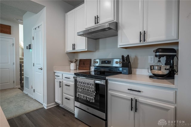 kitchen featuring light countertops, electric range, white cabinets, and under cabinet range hood